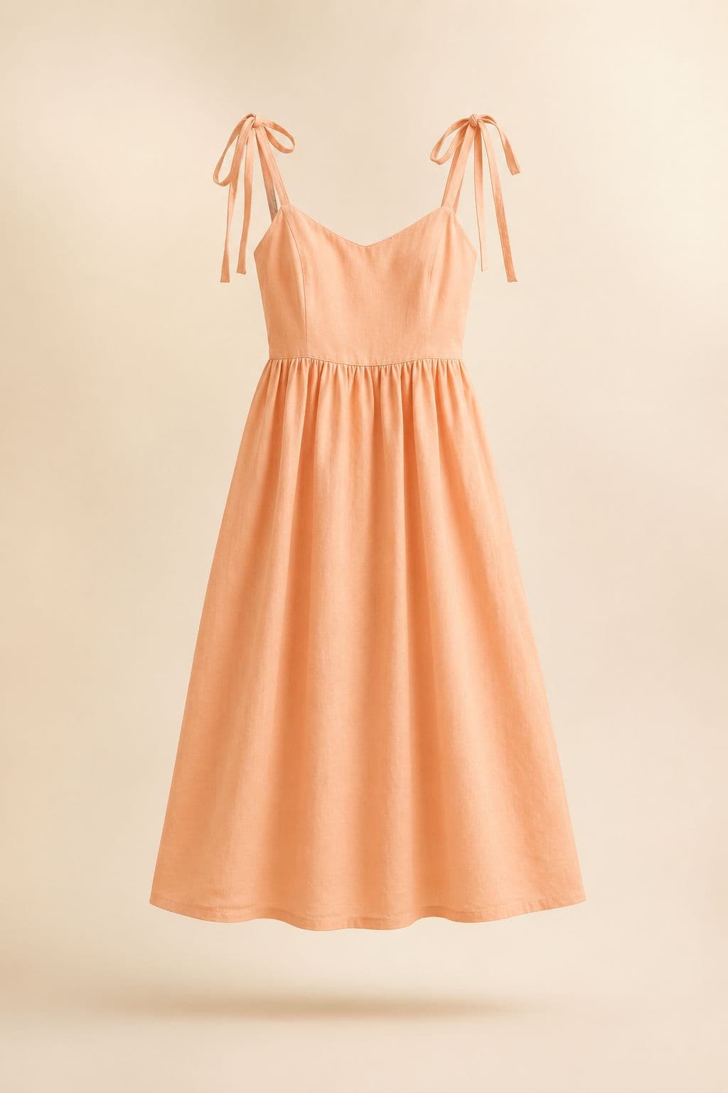 Sundress Adjustable Strap — Tie straps with 11 cm of travel, over a smocked back panel.
