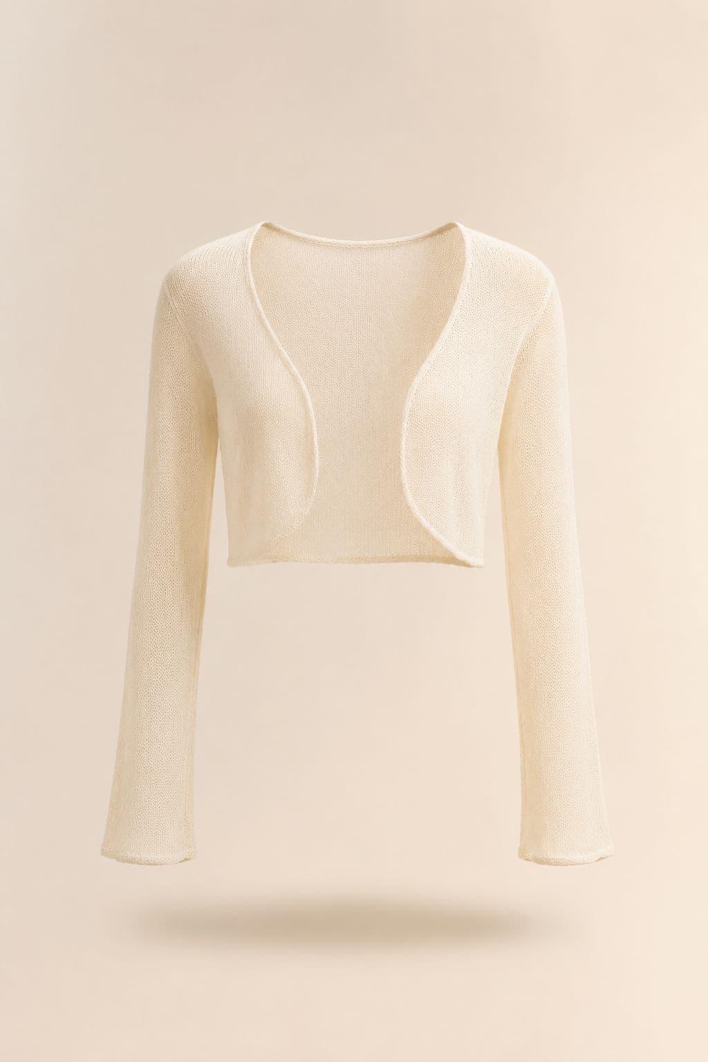 Light Knit Shrug — A cropped fine-gauge shrug that covers the shoulder without covering the bodice.