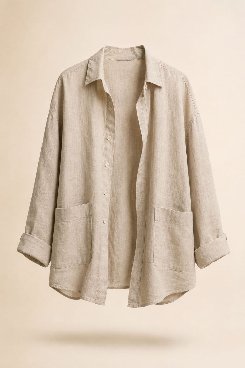 Linen Overshirt — An open-front linen layer cut long enough to cover a midi bodice and short enough to sit in.