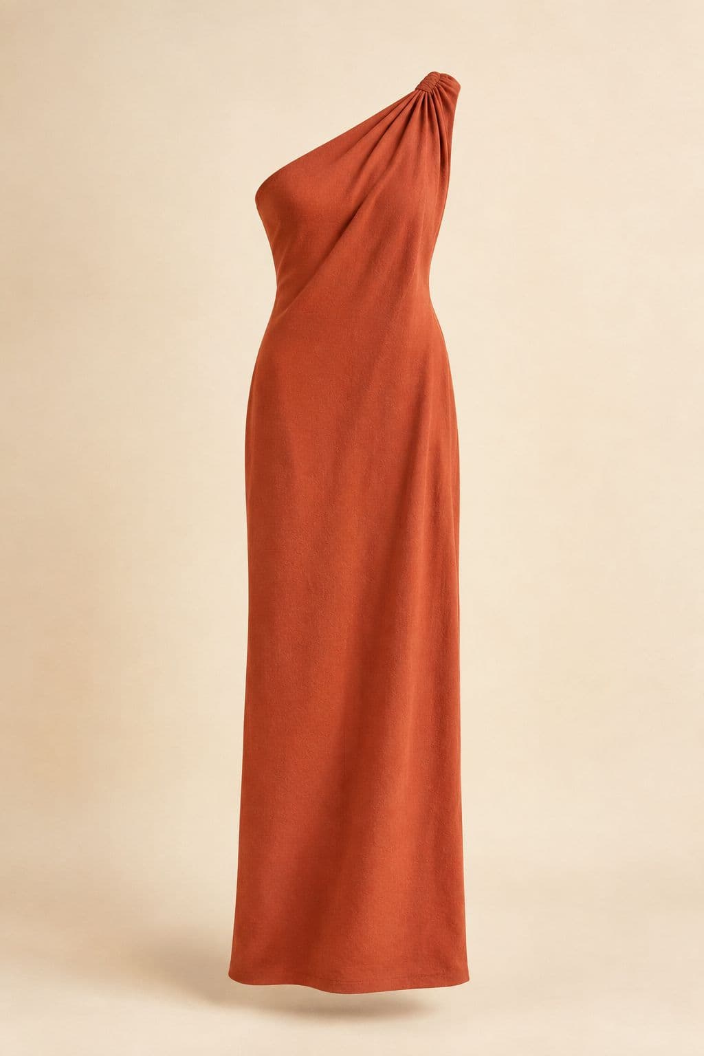 One-Shoulder Maxi — A single asymmetric strap in deep terracotta crepe, fully lined, with interior grip tape.