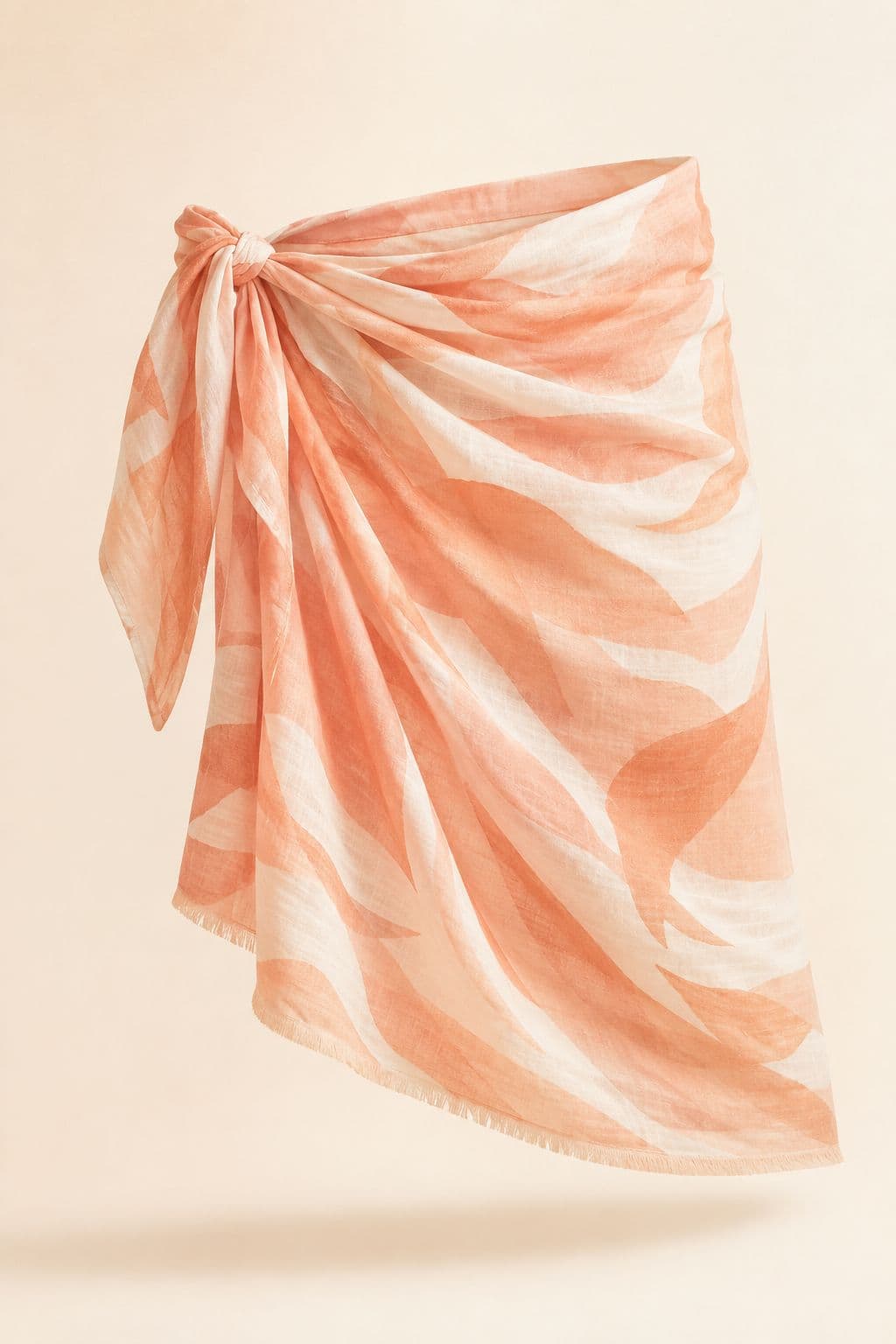 Sarong Wrap — A 110 × 180 cm printed cotton rectangle, with four tying methods illustrated.