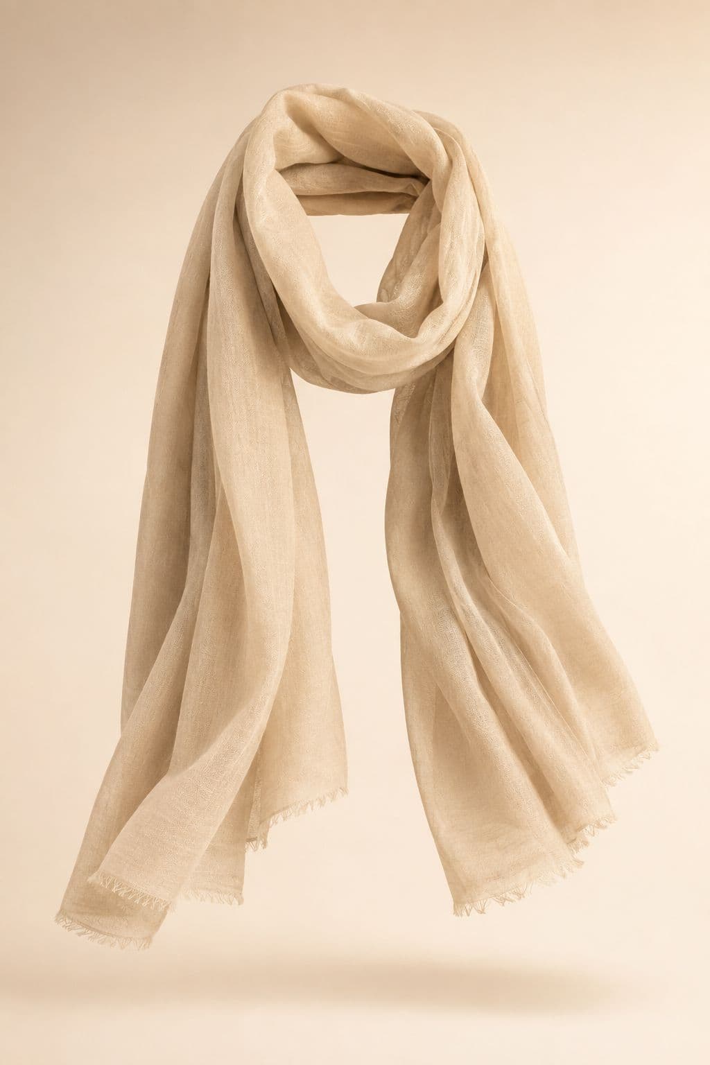 Sun Shawl Long — A 70 × 200 cm woven cotton rectangle, dense enough to sit over the shoulders in sun.